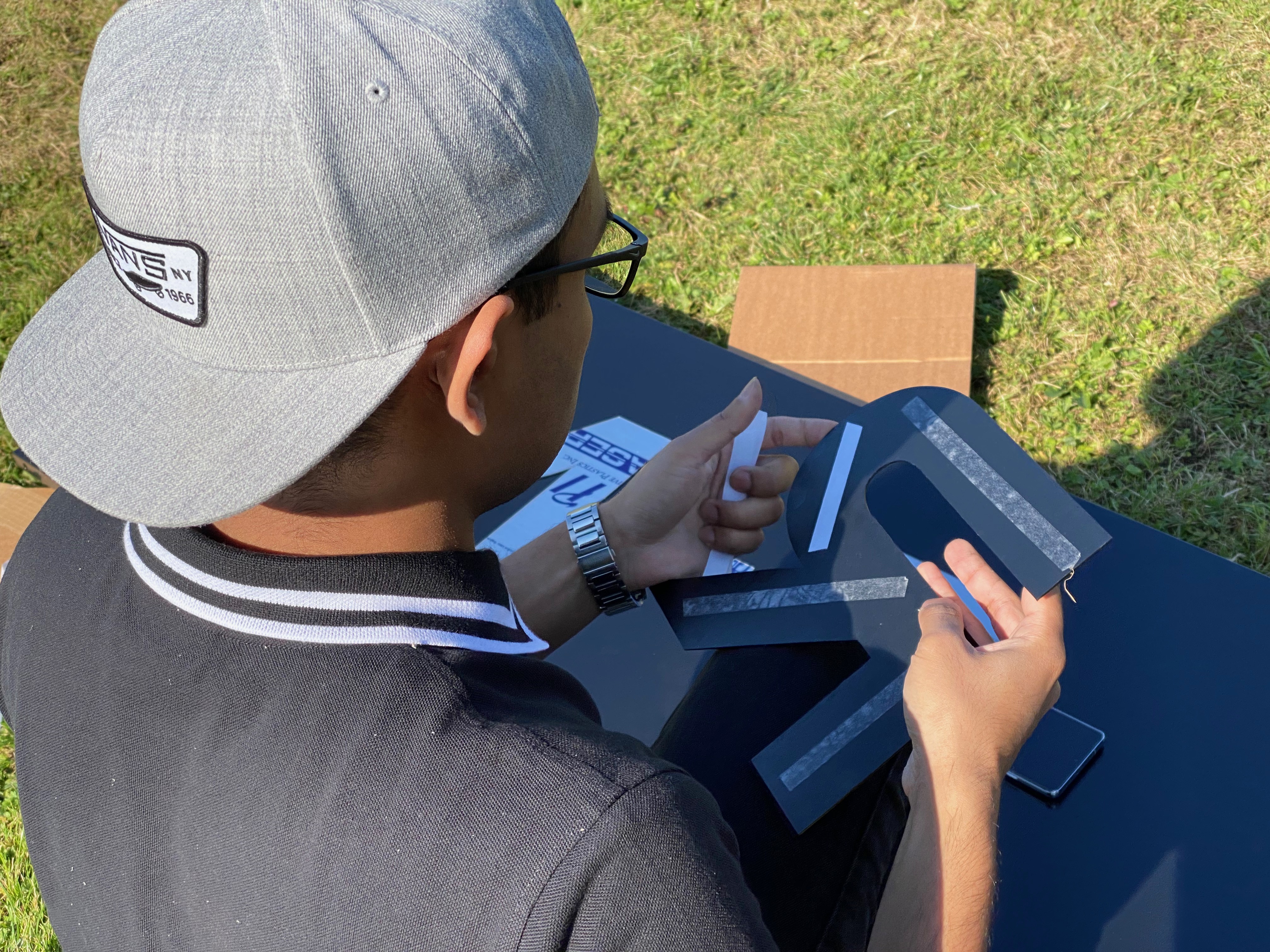 Farabi assembling a component for the M-BRIC energy-storage system